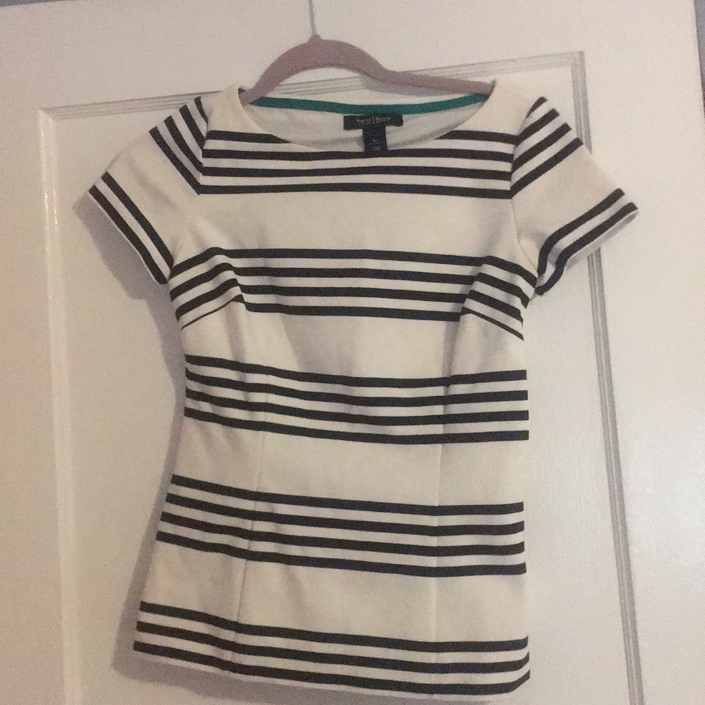 Very flattering. Beautiful quality. Lined